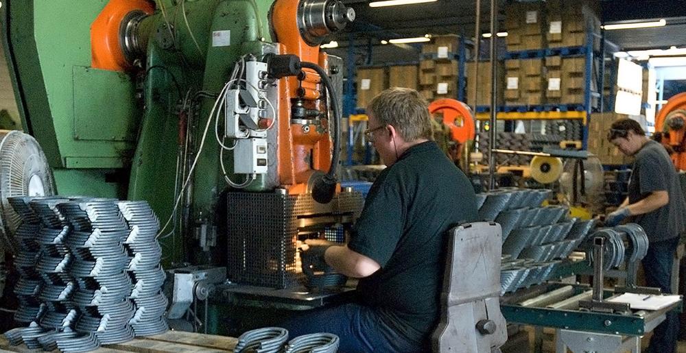 Finishing horseshoes at the Mustad Friesland factory