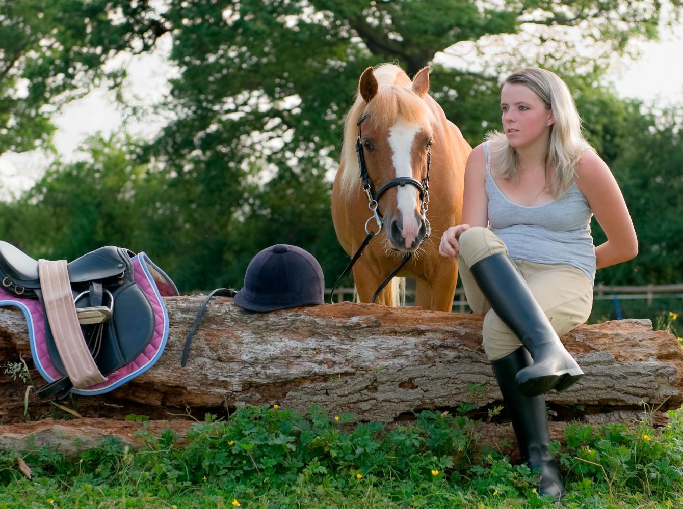 A teenage girl with her pony